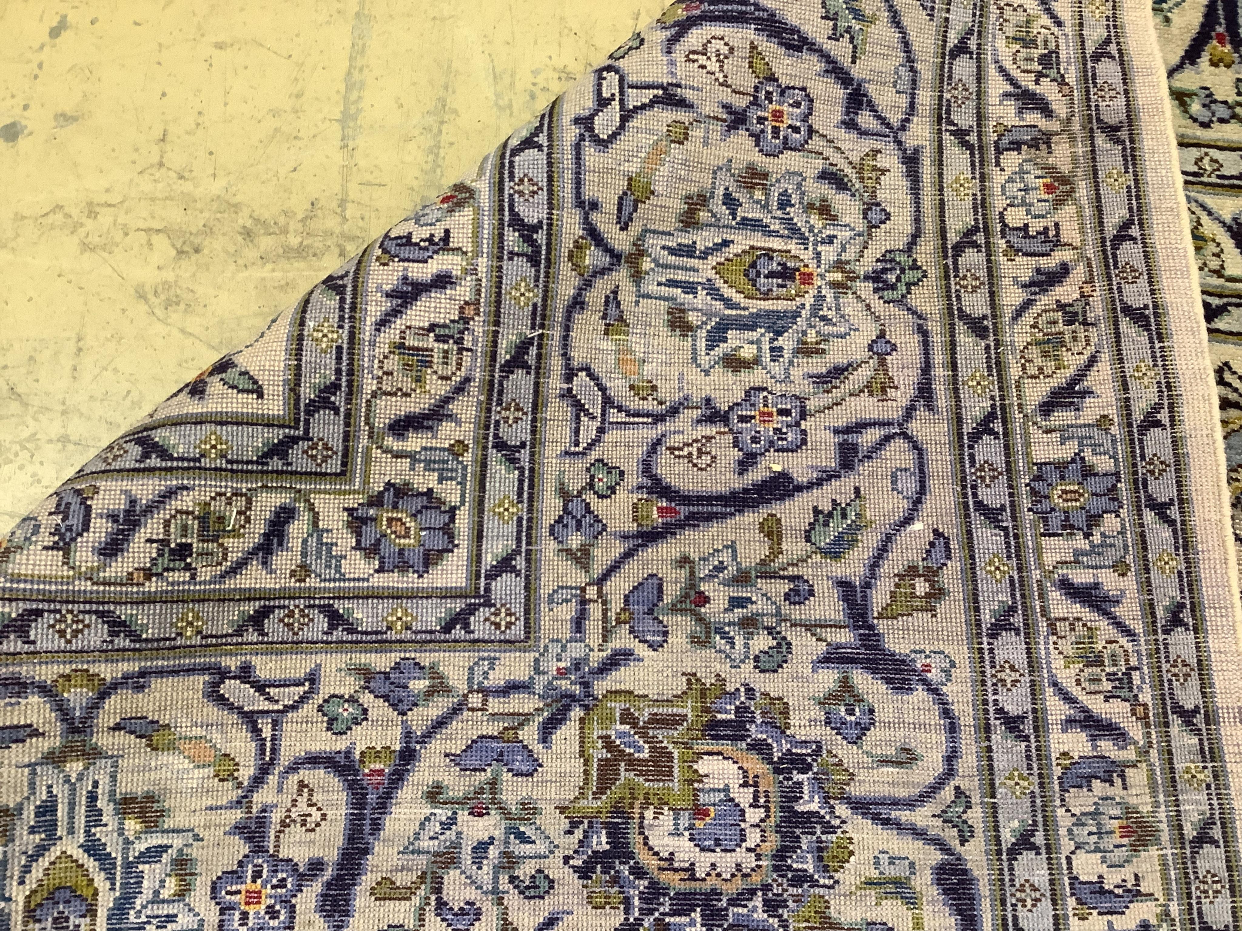 A Kashan ivory ground carpet, 390 x 274cm. Condition - good